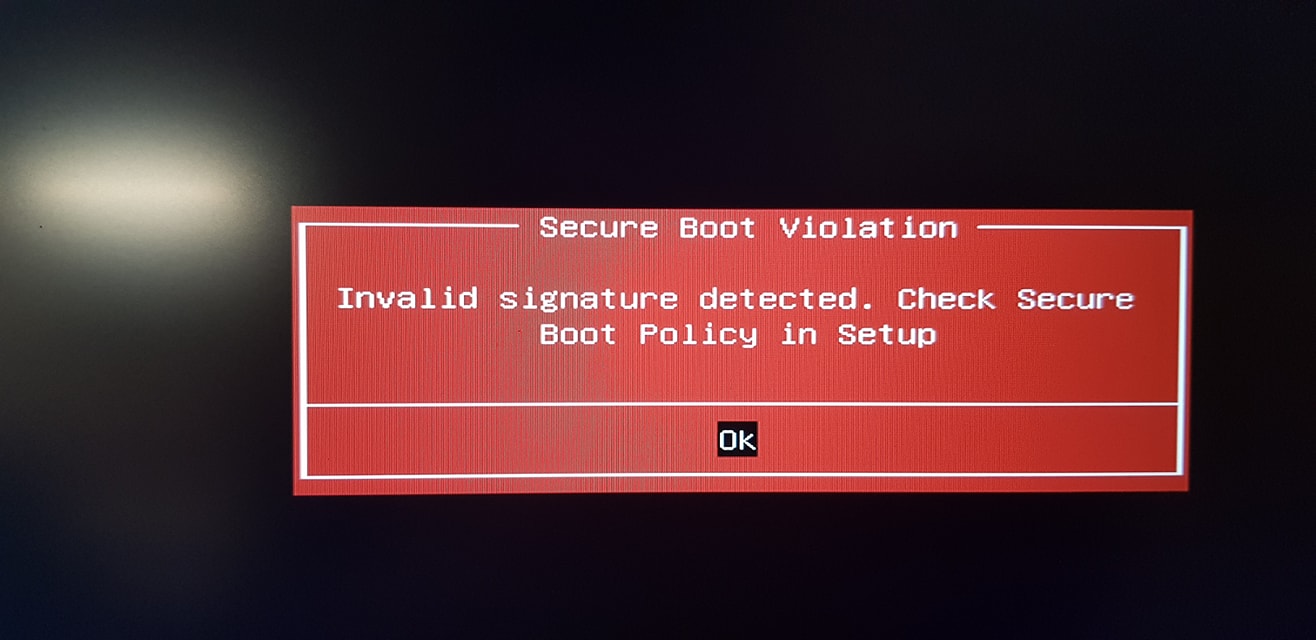 A screen displaying a red error message, saying that the Secure Boot policy has been violated